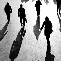 people walking in shadows