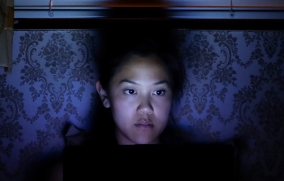 glowing girl in bed