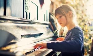 girl playing piano