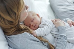 mother with sleeping baby